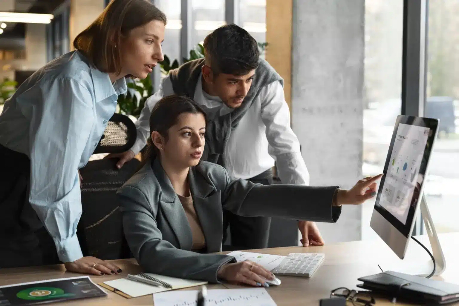 people analyzing checking finance graphs office